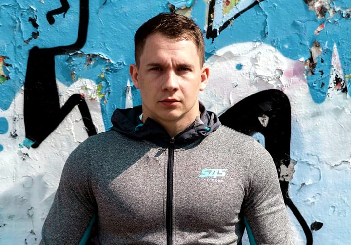 Front view of the hoodie, zipped to the neck