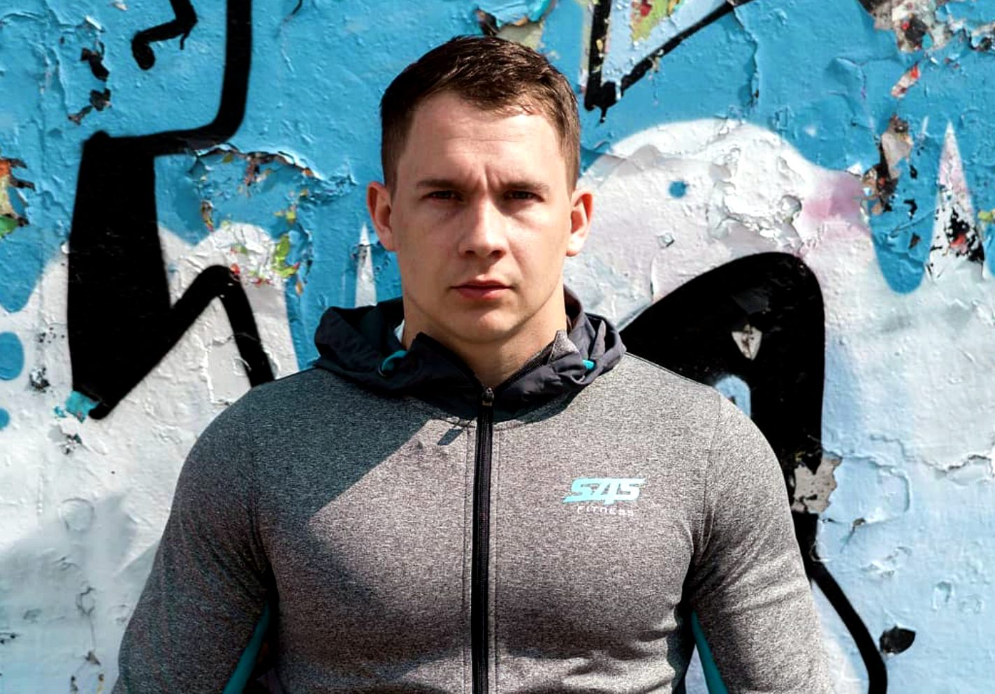 Front view of the hoodie, zipped to the neck